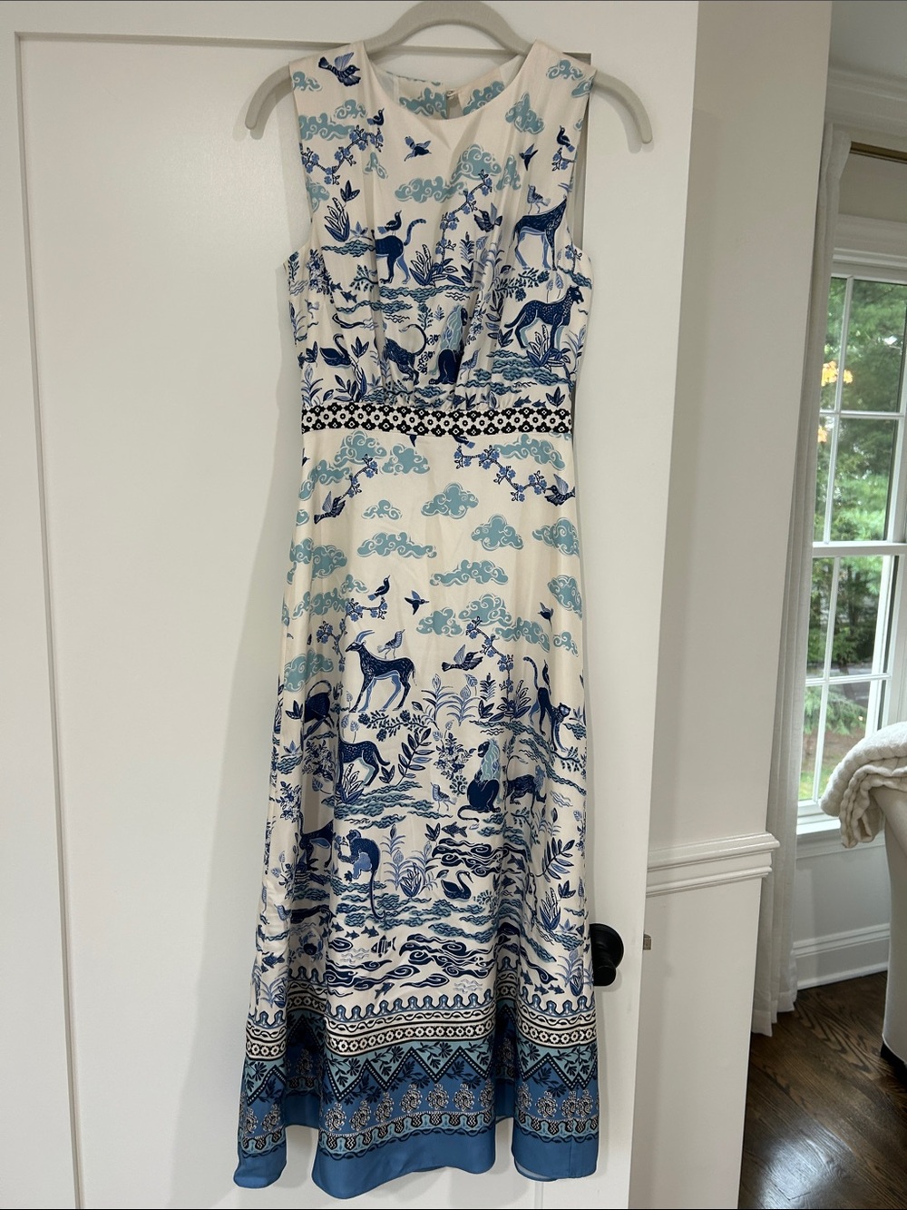Sleeveless White Dress with Blue Scenic Print